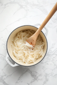 adding-butter-and-sauteing-onions lightly in the oil till the become transparent