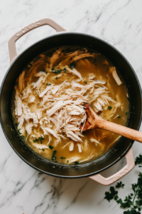 adding-shredded-chicken-in-the-broth so that chicken absorbs the flavors of the broth