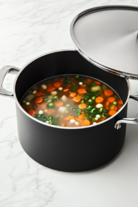 a crockpot filled with a colorful mix of vegetables simmering in broth