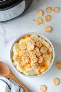 crockpot-cheese-potatoes-ready-to-be-served in a white bowl for dinner or lunch