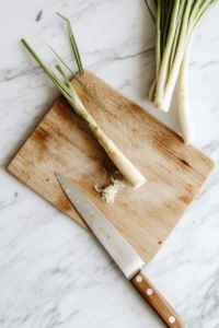 crush-the-lemongrass with a sharp knife on the chopping board