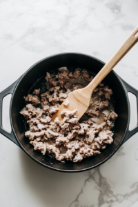 add-ground-sausage into the pan and cook it