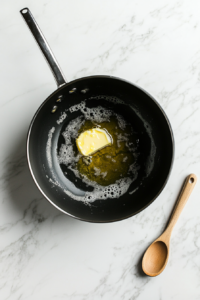 butter-being-melted-in-a-black-pan to toss the vegetables