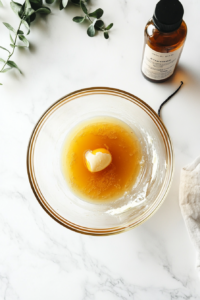 A mixing bowl with softened butter, brown sugar, and granulated sugar being blended together until light and fluffy, the first step in creating a rich cookie dough.