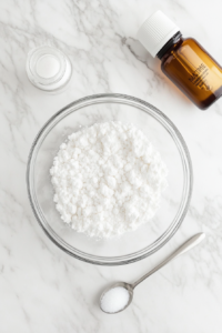 This image shows powdered sugar and vanilla extract being added to the whipped chickpea liquid, enhancing the flavor of the vegan whipped cream.