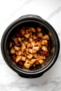 slow cooker with a liner being properly placed to ensure a mess-free cooking experience for chicken fajitas.