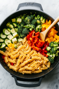 combining-pasta-vegetables-and-red-creamy-sauce-in-a-large-pot-for-20-minute-vegetable-pasta