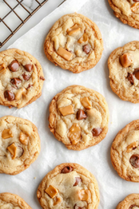 Salted caramel cookies resting on a wire cooling rack, allowing them to set perfectly before serving or storing.