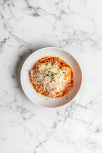 This image shows the crockpot lasagna resting after cooking, allowing the layers to set for easier slicing and serving.