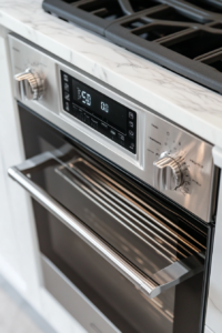 This image shows an oven display set to the appropriate temperature, preheating in preparation for baking the vegan and gluten-free pumpkin pie.