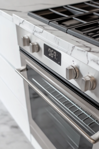 This image shows an oven being preheated to the appropriate temperature, preparing for baking the crust of the vegan dark chocolate tart.