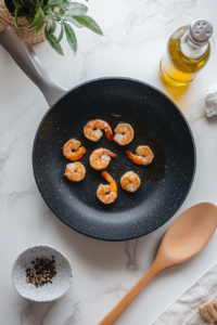 searing-cajun-seasoned-shrimp-on-one-side-in-a-hot-skillet