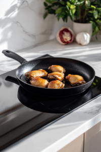 This image shows finely chopped onions and garlic sizzling in the pan, absorbing the flavorful bacon fat to create a rich, aromatic base for the casserole.