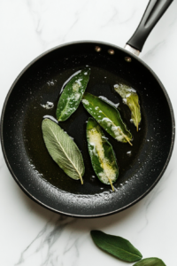 crisping-up-fresh-sage-leaves-in-butter-for-a-crunchy-garnish