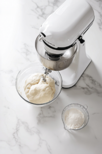 flour-being-added-to-yeast-mixture-for-bread-dough-2