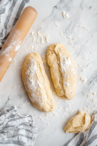 forming-bread-dough-into-loaf-shape-for-second-rise