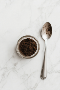 This image shows a bowl filled with a blend of aromatic spices being mixed together to create a flavorful pastrami rub for the turkey.