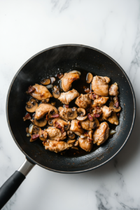 This image shows a casserole dish placed in the oven, where the chicken slowly simmers to tender perfection, absorbing all the rich flavors.