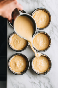 pouring-yorkshire-pudding-batter-into-hot-oil-filled-muffin-tins