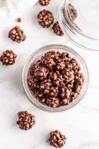 This image shows peanut clusters neatly stored in an airtight container, ensuring they stay fresh and ready to enjoy later.