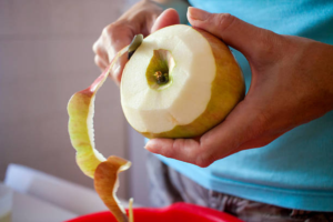 coconut-being-peeled-with-a-sharp-knife-easily-to-save-time-and-effort