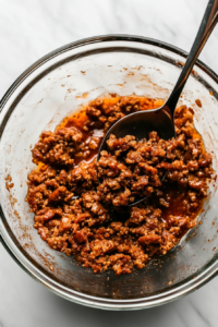 transferring-cooked-sausage-to-bowl-top-down-view