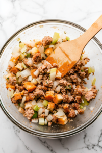 transferring-stuffing-mixture-to-bowl-top-down-view