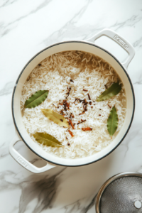 cooking-rice-in-large-white-pot-white-marble-countertop